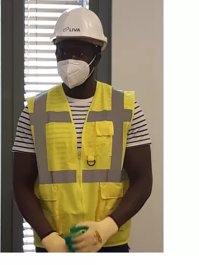 an employee wearing his post-covid equipment